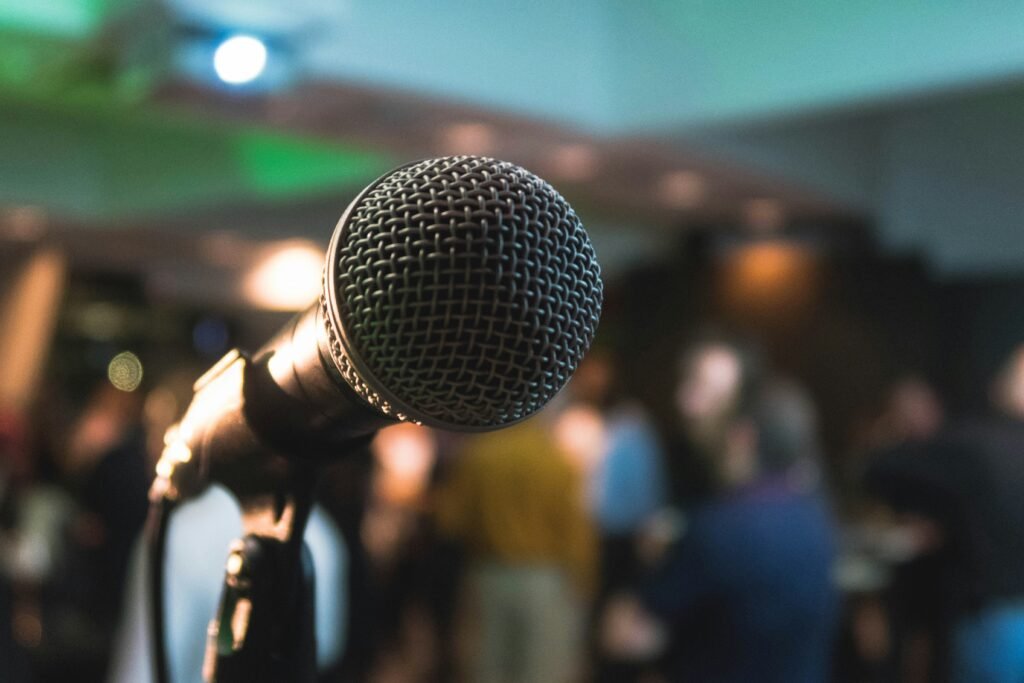 Microphone with people blurred in the background